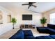 Bright living room featuring tile flooring, ceiling fan, and a decorative fireplace at 331 Marquee Dr, Kissimmee, FL 34758