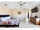 Tranquil main bedroom boasts high ceilings, tile floors, and an en-suite bathroom at 331 Marquee Dr, Kissimmee, FL 34758