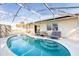 Enjoy this screened-in pool with plenty of space for outdoor dining and lounging at 331 Marquee Dr, Kissimmee, FL 34758