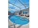Stunning pool with a screened enclosure and multiple access points to the house at 331 Marquee Dr, Kissimmee, FL 34758