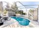 Relax in this screened-in pool area with ample room for dining and recreation at 331 Marquee Dr, Kissimmee, FL 34758