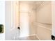 Spacious walk-in closet featuring ample shelving for storage and organization at 331 Marquee Dr, Kissimmee, FL 34758