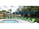 Community hot tub and sun loungers under shade canopies surrounded by palm trees at 4446 Shiva Loop, Kissimmee, FL 34746