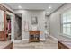 Bathroom featuring wood-look floors, stone shower, and wooden vanity with glass doors at 506 Parrott Rd, Auburndale, FL 33823