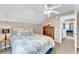 Well-lit bedroom with a dresser, closet, and carpeted floors at 506 Parrott Rd, Auburndale, FL 33823