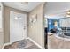 Entryway with a white door and decorative rug leading into the living room at 506 Parrott Rd, Auburndale, FL 33823