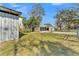 The property features multiple metal buildings, a wood covered bar, and green grass at 506 Parrott Rd, Auburndale, FL 33823