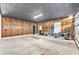 Spacious garage with a black ceiling and wood paneling on the walls at 506 Parrott Rd, Auburndale, FL 33823