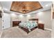 Beautiful main bedroom featuring a decorative wood plank ceiling, carpet floors, and ample space at 506 Parrott Rd, Auburndale, FL 33823