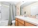 Bathroom featuring vanity, sink, toilet and shower with framed botanical prints on the wall at 5409 Limestone Ln, Lakeland, FL 33809