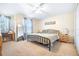 Comfortable bedroom featuring a wrought-iron bed frame and plenty of natural light at 5409 Limestone Ln, Lakeland, FL 33809