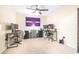 Spacious bedroom featuring two workstations, ceiling fan and wall decor at 5409 Limestone Ln, Lakeland, FL 33809