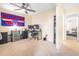 Spacious bedroom featuring workstation, ceiling fan and view of a second bedroom at 5409 Limestone Ln, Lakeland, FL 33809