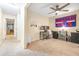 Spacious bedroom featuring a workstation, ceiling fan and open hallway at 5409 Limestone Ln, Lakeland, FL 33809