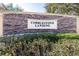 Stone sign for Cobblestone Landing surrounded by lush greenery at 5409 Limestone Ln, Lakeland, FL 33809