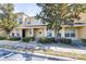 Inviting townhome exterior showcasing well-maintained landscaping and a covered front entrance at 5409 Limestone Ln, Lakeland, FL 33809