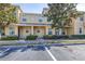 Townhome exterior featuring a well-kept lawn and a covered entry for a welcoming first impression at 5409 Limestone Ln, Lakeland, FL 33809