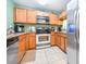 Well-lit kitchen featuring stainless steel appliances, granite countertops, and light wood cabinetry at 5409 Limestone Ln, Lakeland, FL 33809