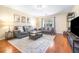 Cozy living room featuring modern furniture and hardwood floors at 5409 Limestone Ln, Lakeland, FL 33809