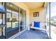 Relaxing screened patio featuring modern gray rug, comfortable seating and sliding glass door at 5409 Limestone Ln, Lakeland, FL 33809