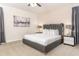 Elegant Primary bedroom, featuring a king-size bed and stylish decor at 7705 Fairfax Dr, Kissimmee, FL 34747