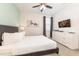 Spacious bedroom with a king-size bed and a large TV at 7705 Fairfax Dr, Kissimmee, FL 34747