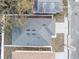 Aerial view of the property with a well-maintained roof and fenced yard at 833 Texas Ave, Lakeland, FL 33815