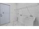 Clean laundry room with white walls, sink, and marble floors near an exterior door at 833 Texas Ave, Lakeland, FL 33815