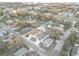 Birds eye shot of homes nestled in a quiet neighborhood with mature trees and green lawns at 835 Texas Ave, Lakeland, FL 33815