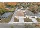 A high-angle shot of a yellow house and garage with a gray roof at 835 Texas Ave, Lakeland, FL 33815