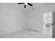 Bright bedroom featuring ceiling fan, closet, marble flooring, and an adjacent kitchen at 835 Texas Ave, Lakeland, FL 33815