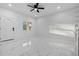 Bright living room with marble floors, large window, and modern minimalist design at 835 Texas Ave, Lakeland, FL 33815