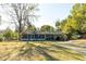 Charming single-story home with a screened porch, carport and a well-maintained front yard at 922 Se 13Th St, Ocala, FL 34471