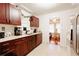 Functional kitchen with wooden cabinets, white countertops, and modern appliances at 922 Se 13Th St, Ocala, FL 34471