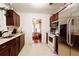 Well-lit kitchen with wooden cabinets, stainless steel appliances and a view to the dining nook at 922 Se 13Th St, Ocala, FL 34471