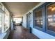 Inviting screened-in porch with blue trim, decorative tile, and a view of the surrounding neighborhood at 922 Se 13Th St, Ocala, FL 34471