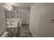 Bathroom with double sinks, and glass-enclosed shower at 1907 Eliza Ann St, Kissimmee, FL 34758