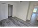 Bedroom featuring a closet and gray plank flooring at 1907 Eliza Ann St, Kissimmee, FL 34758