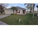 Charming one story home with landscaped yard and attached two car garage at 1907 Eliza Ann St, Kissimmee, FL 34758