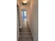 Hallway with plank flooring leads to rooms filled with natural light at 1907 Eliza Ann St, Kissimmee, FL 34758