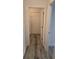 Hallway with modern plank floors offers seamless transitions at 1907 Eliza Ann St, Kissimmee, FL 34758