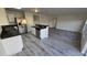 Well-lit kitchen features stainless steel appliances, and an island with a sink at 1907 Eliza Ann St, Kissimmee, FL 34758