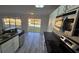 Kitchen boasts stainless appliances and views of a tranquil pond at 1907 Eliza Ann St, Kissimmee, FL 34758