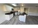 A stylish kitchen with white cabinetry, stainless steel appliances, and modern countertops at 1907 Eliza Ann St, Kissimmee, FL 34758