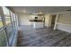 Bright kitchenette offering backyard pond views with sleek black countertops and modern appliances at 1907 Eliza Ann St, Kissimmee, FL 34758