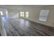 Spacious living room featuring hardwood floors and an abundance of natural light at 1907 Eliza Ann St, Kissimmee, FL 34758
