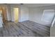 Bright main bedroom with plank flooring and large window for natural light at 1907 Eliza Ann St, Kissimmee, FL 34758