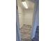 Walk-in closet with shelves and wood-style flooring at 1907 Eliza Ann St, Kissimmee, FL 34758