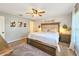 Bright main bedroom features a ceiling fan, a decorative accent wall, and neutral paint at 6830 Krenson Oaks Cir, Lakeland, FL 33810