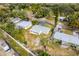 Overhead shot of the property, highlighting the home's location within a residential neighborhood surrounded by mature trees at 1220 George St, Winter Springs, FL 32708